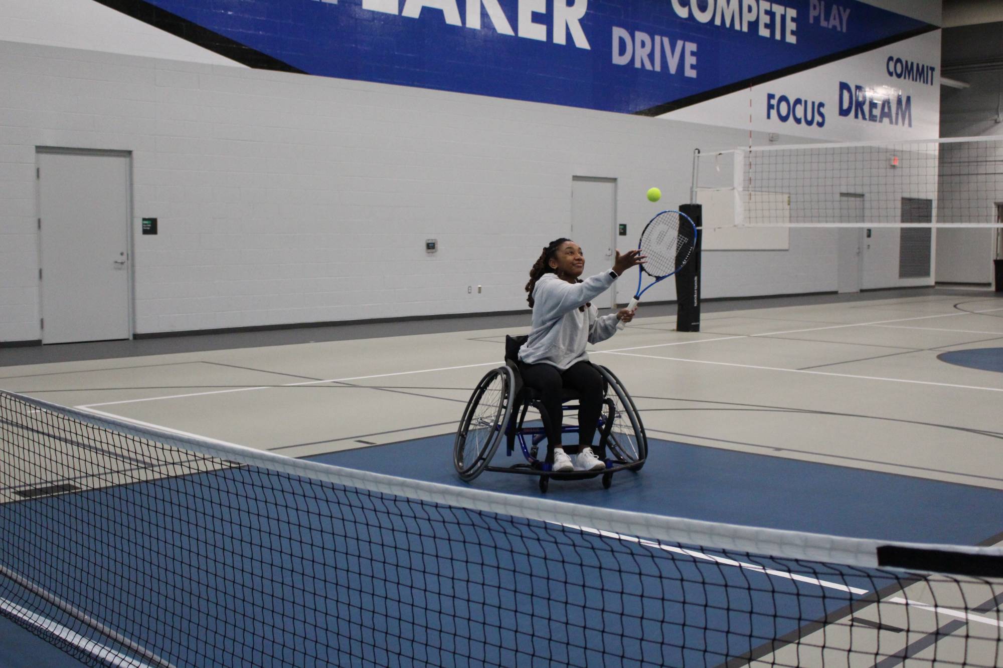 Student playing wheelchair tennis at an adaptive sports intramural event